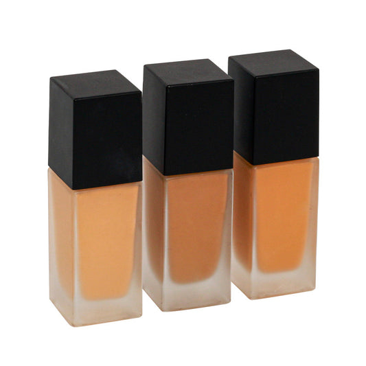 Dark brown concealing foundation with a sun-tanned, wheat-colored, and moist finish
