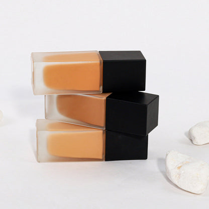 Dark brown concealing foundation with a sun-tanned, wheat-colored, and moist finish