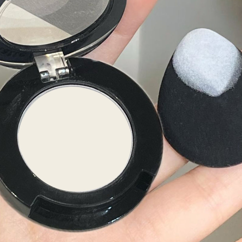 A white highlight powder that brightens the tear troughs, fills in wrinkles, provides long-lasting color, has a matte finish, and can be used on both cheeks and face