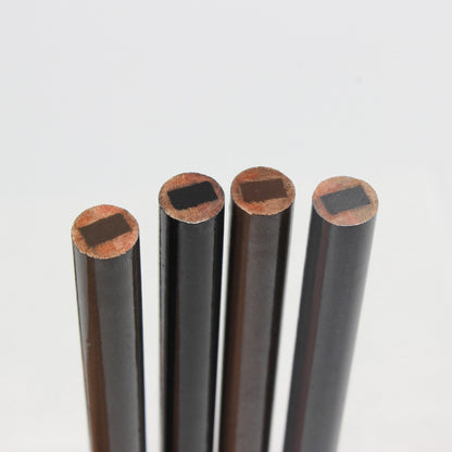 Hard-core scissor-shaped eyebrow pencil, a semi-permanent eyebrow pencil for permanent makeup artists, creating defined individual eyebrow hairs.