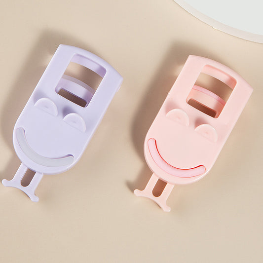 Portable eyelash curler for long-lasting curl and shaping, comes with replacement pads. Ideal for beginners. Mini tweezers.